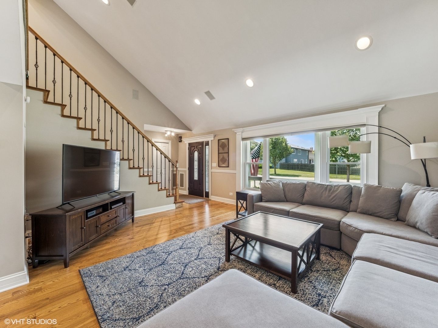 651 Garth Road Wheeling, IL 60090 - Photo 3 of 24 a living room with furniture and a flat screen tv