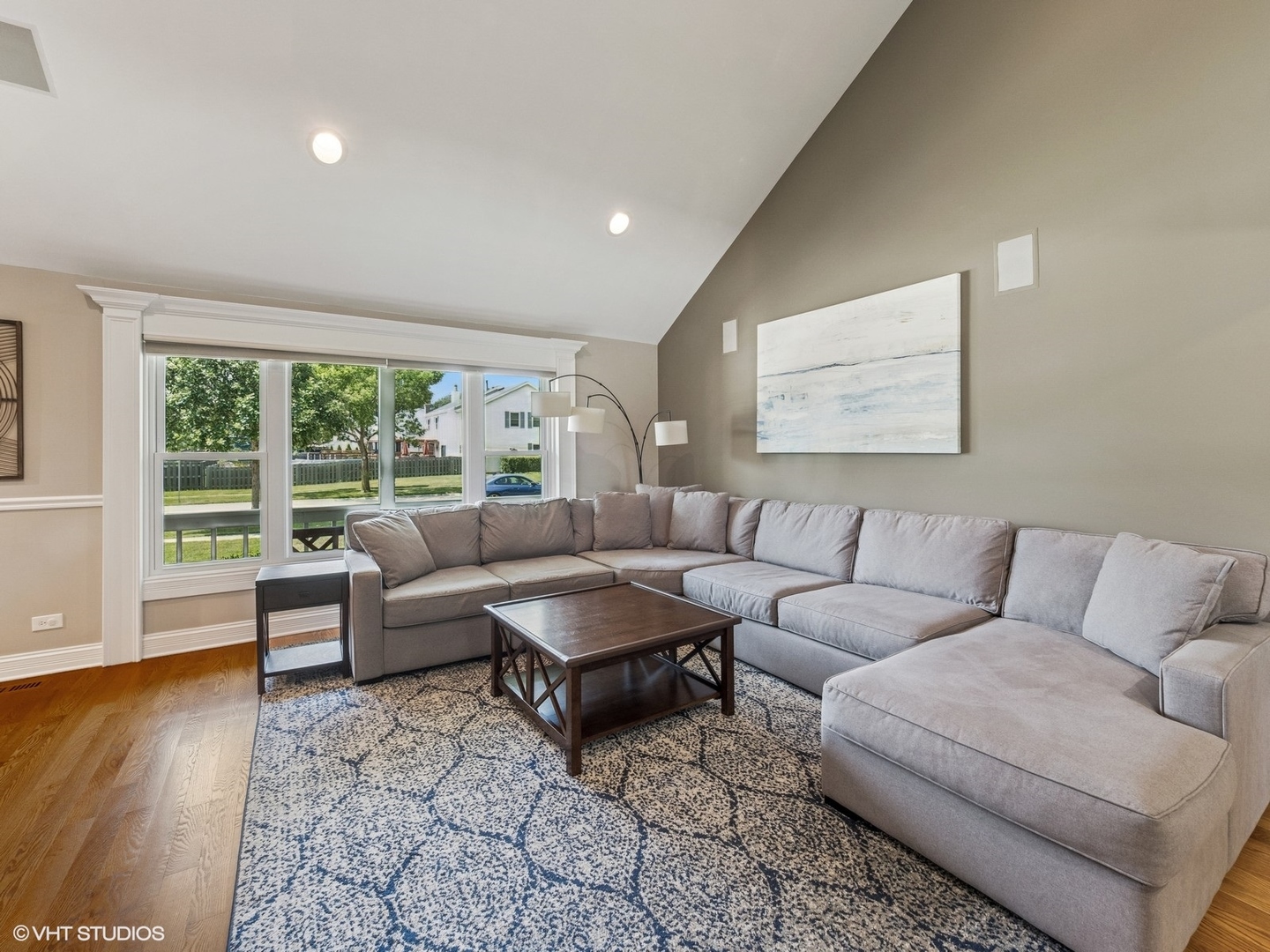 651 Garth Road Wheeling, IL 60090 - Photo 4 of 24 a living room with furniture and a large window