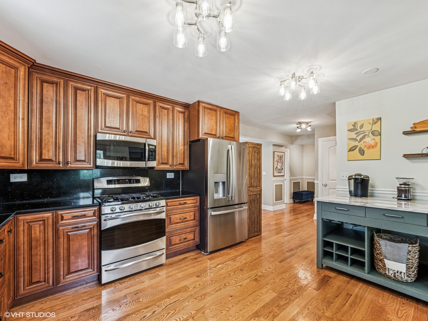 651 Garth Road Wheeling, IL 60090 - Photo 6 of 24 a kitchen with stainless steel appliances a stove refrigerator and microwave