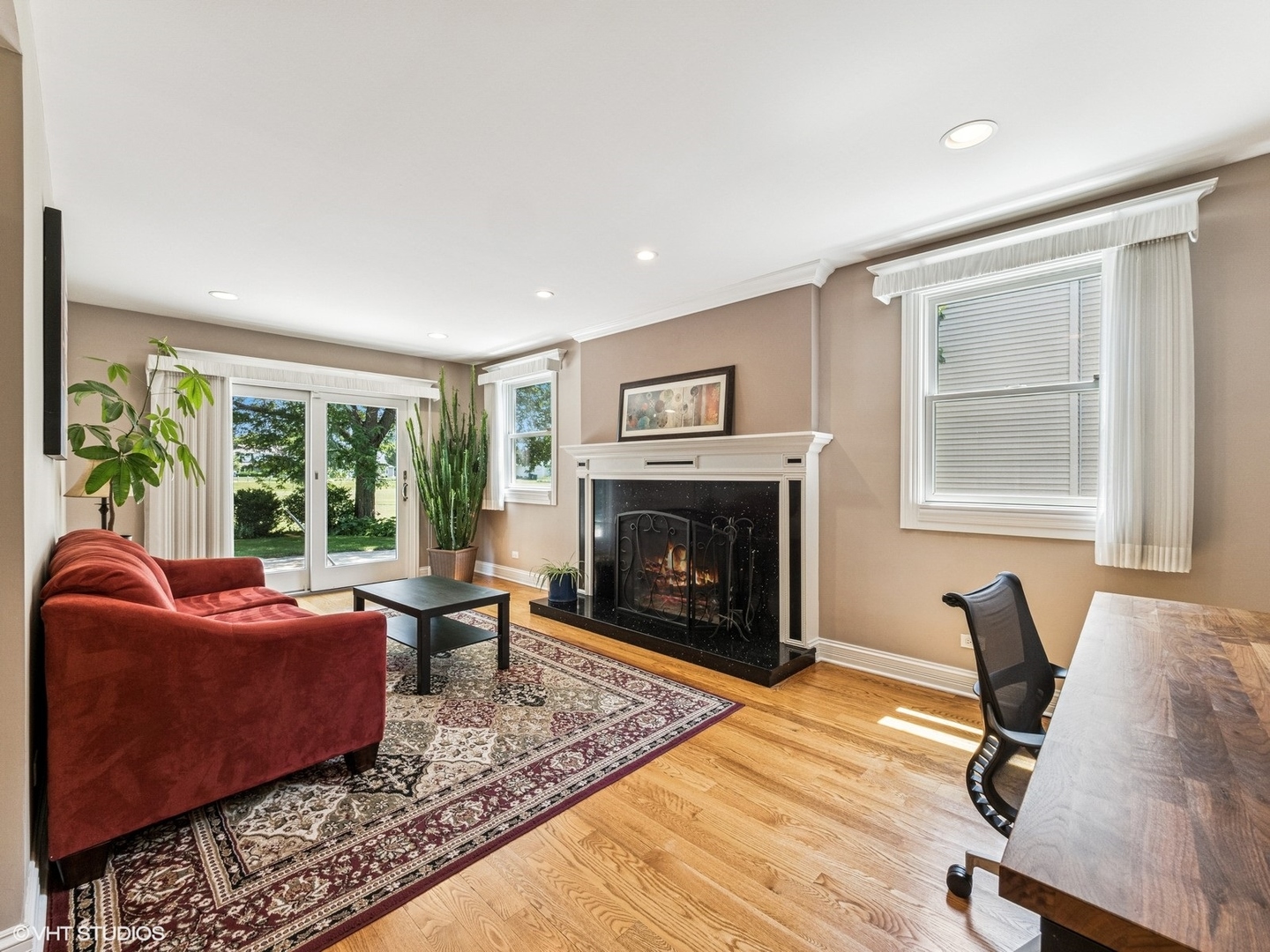 651 Garth Road Wheeling, IL 60090 - Photo 7 of 24 a living room with furniture and a fireplace
