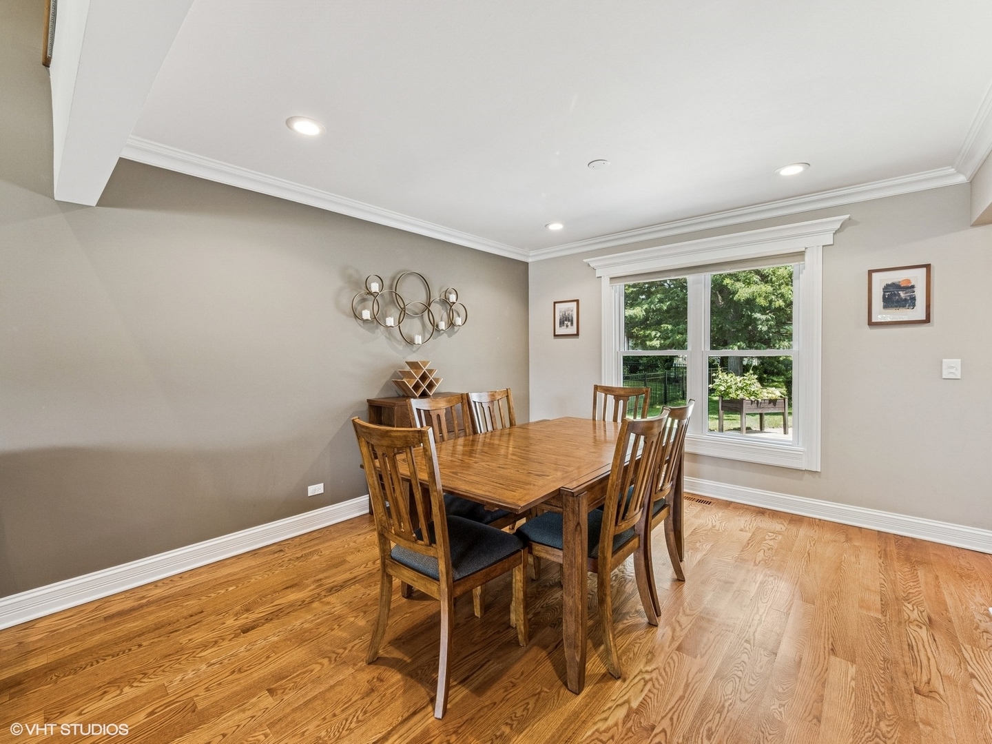 651 Garth Road Wheeling, IL 60090 - Photo 9 of 24 a view of a dining room with furniture window and wooden floor