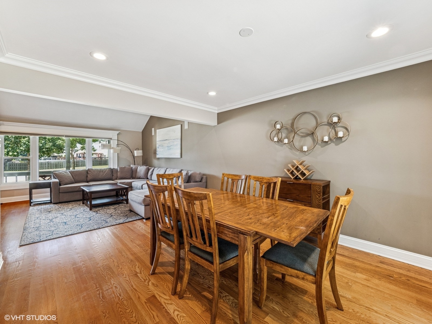 651 Garth Road Wheeling, IL 60090 - Photo 10 of 24 a view of a dining room with furniture and wooden floor