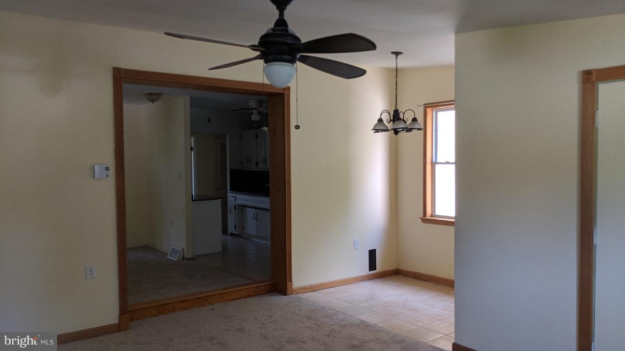 1 Wengate Road Owings Mills, MD 21117 - Photo 16 of 24 an empty room and chandelier fan in a room