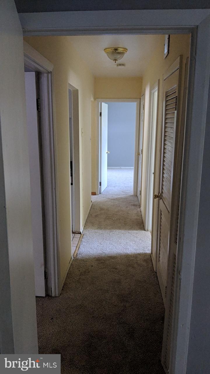 1 Wengate Road Owings Mills, MD 21117 - Photo 18 of 24 a view of a hallway with wooden floor and a livingroom