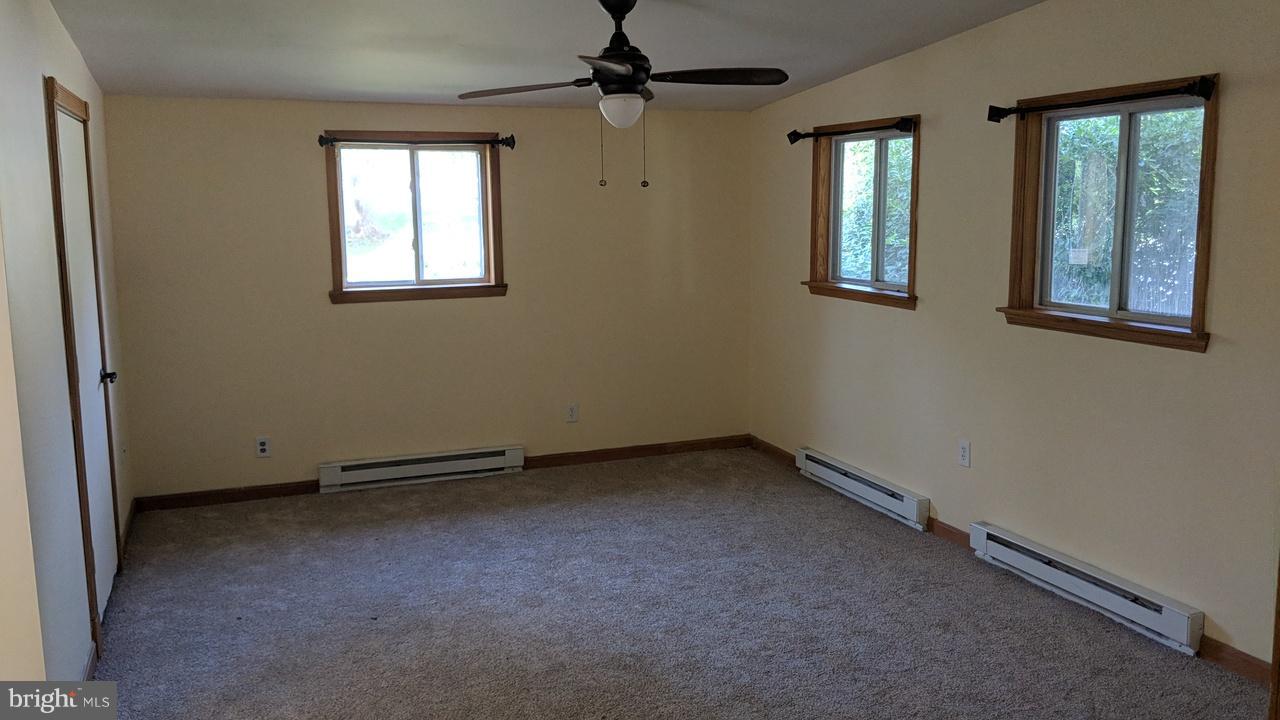 1 Wengate Road Owings Mills, MD 21117 - Photo 4 of 24 an empty room with windows and fan