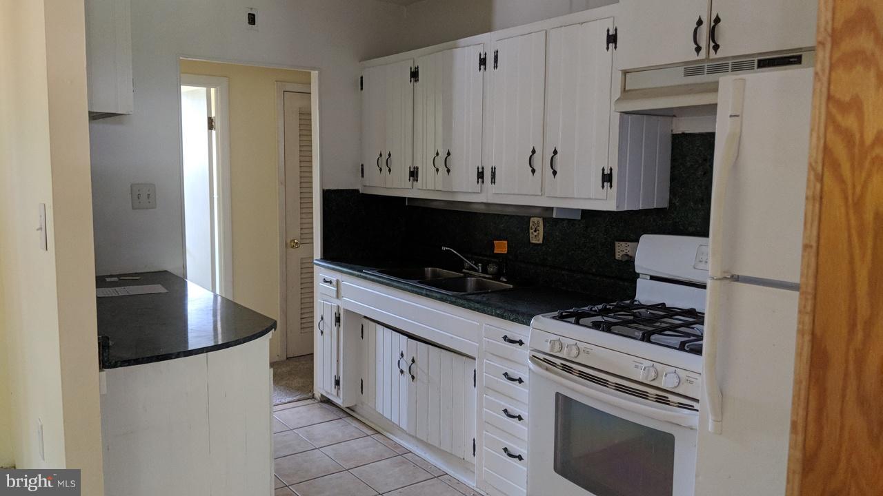 1 Wengate Road Owings Mills, MD 21117 - Photo 8 of 24 a kitchen with cabinets and appliances