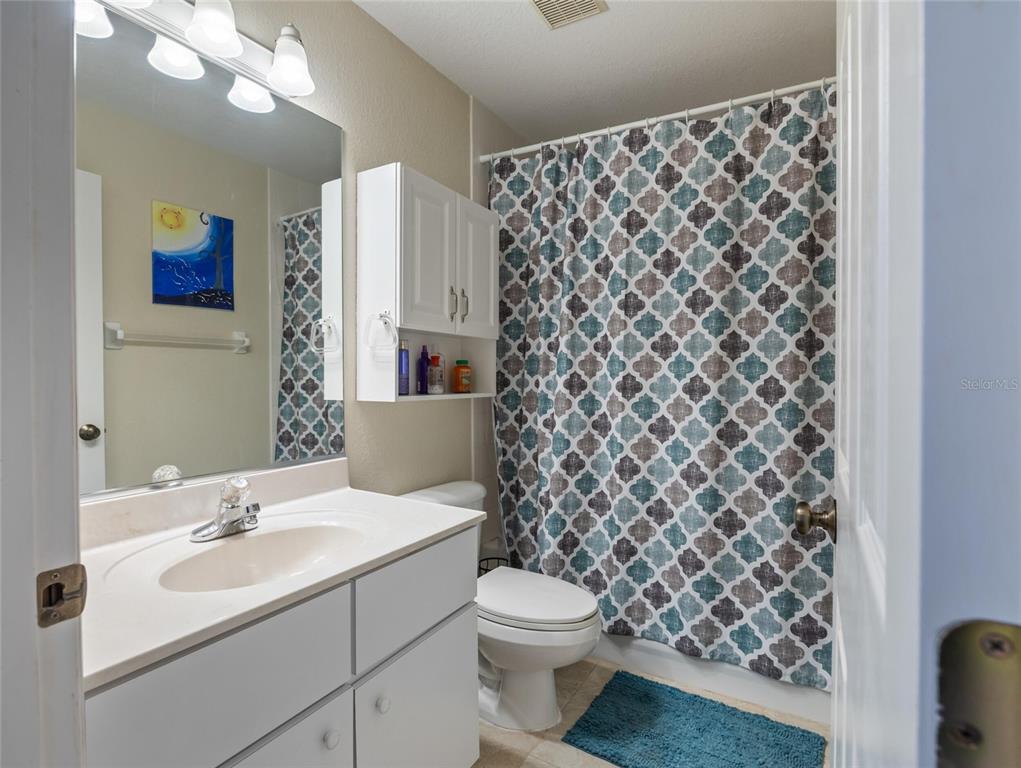 6724 Cherry Road Ocala, FL 34472 - Photo 14 of 29 a bathroom with a sink a toilet and a shower