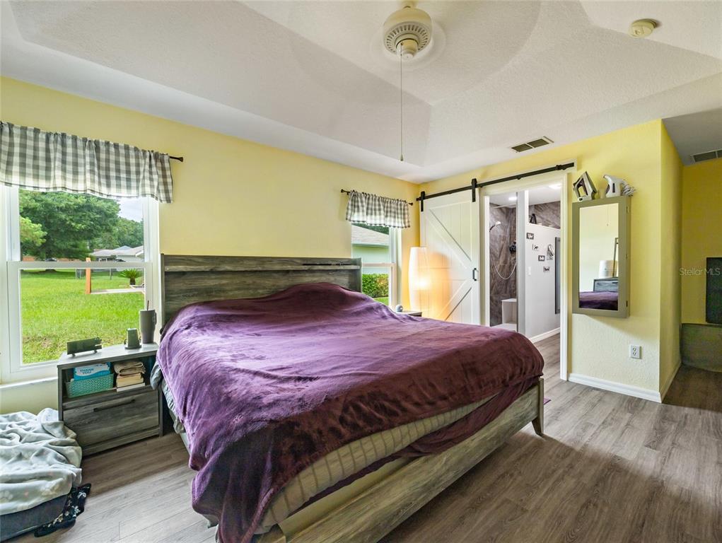 6724 Cherry Road Ocala, FL 34472 - Photo 20 of 29 a bed sitting in a bedroom next to a window