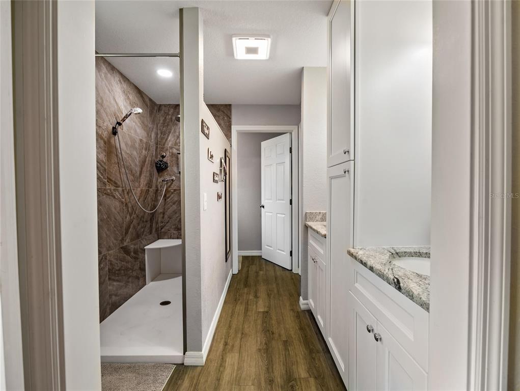 6724 Cherry Road Ocala, FL 34472 - Photo 22 of 29 a bathroom with a glass shower door