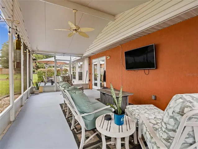 a patio with couches and table