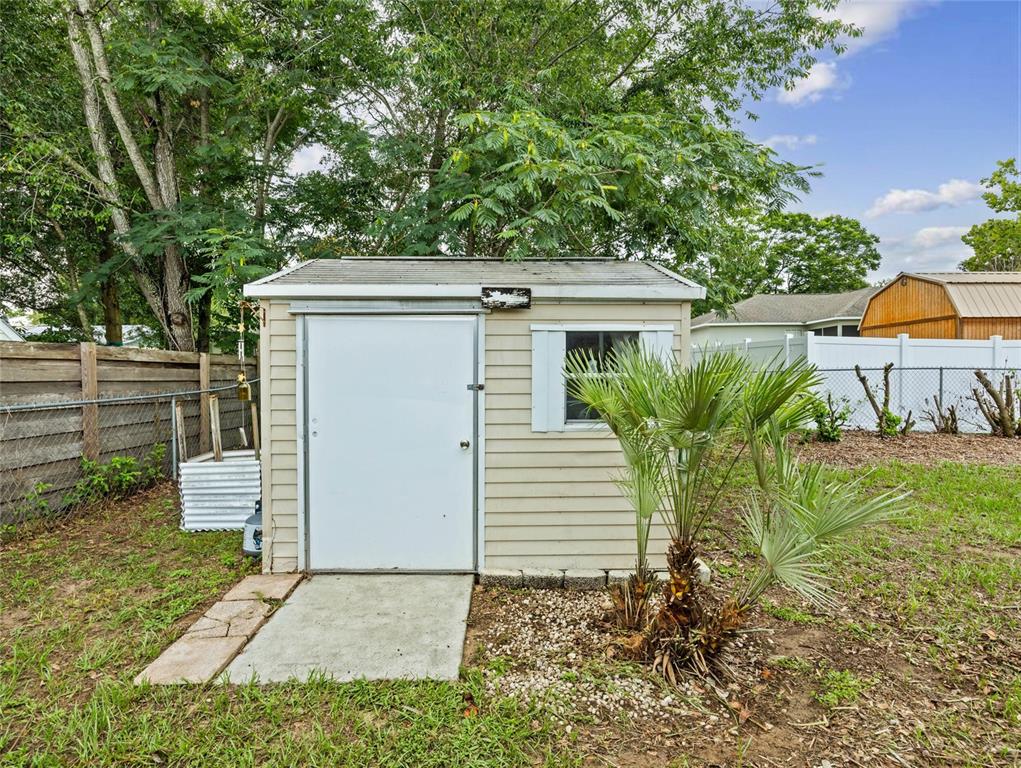 6724 Cherry Road Ocala, FL 34472 - Photo 28 of 29 a view of a house with a yard and plants