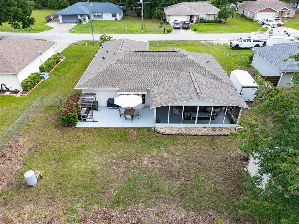 6724 Cherry Road Ocala, FL 34472 - Photo 5 of 29 a aerial view of a house with a yard and lake