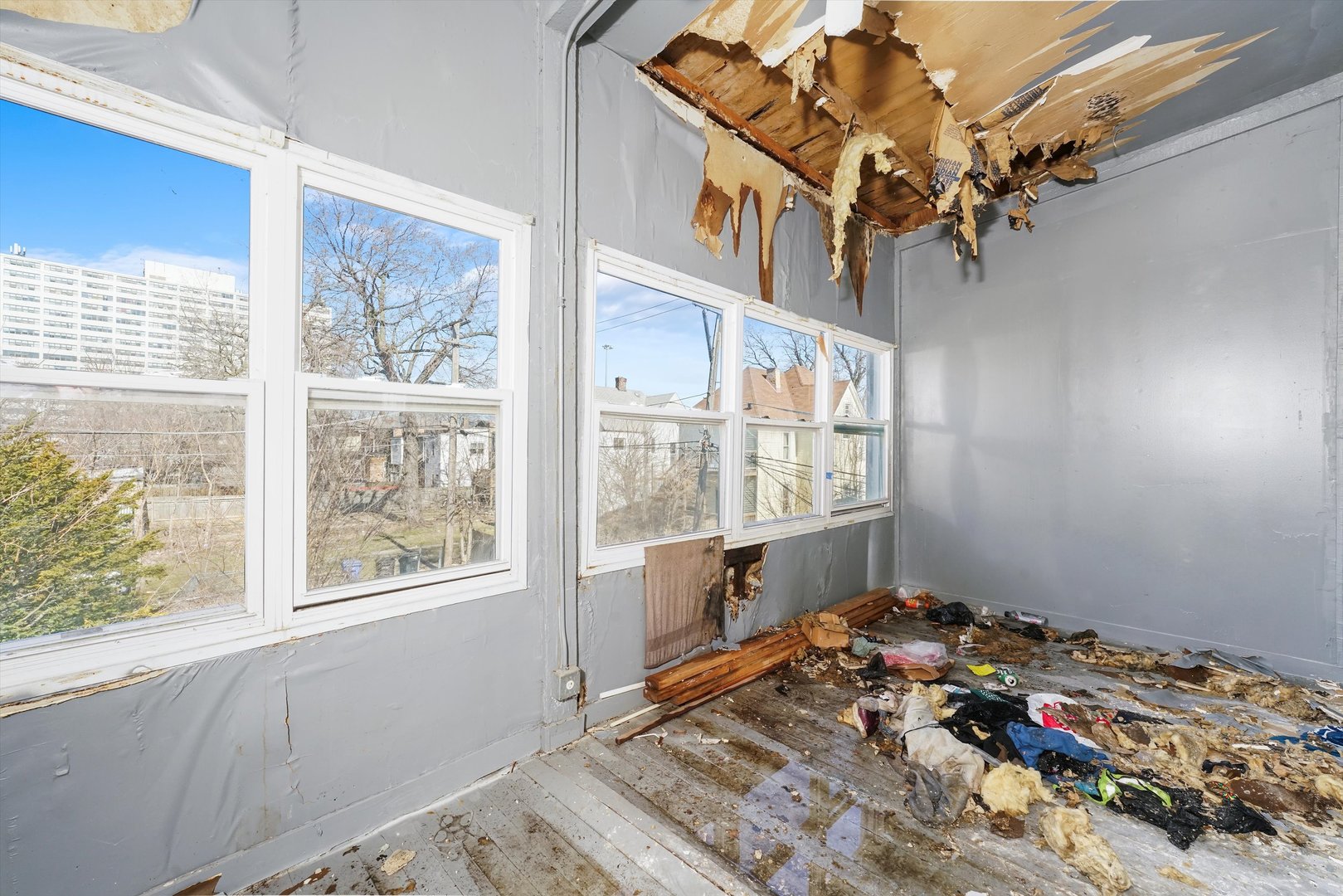 58 West 72nd Street Chicago, IL 60621 - Photo 16 of 28 a bedroom with bed and a window