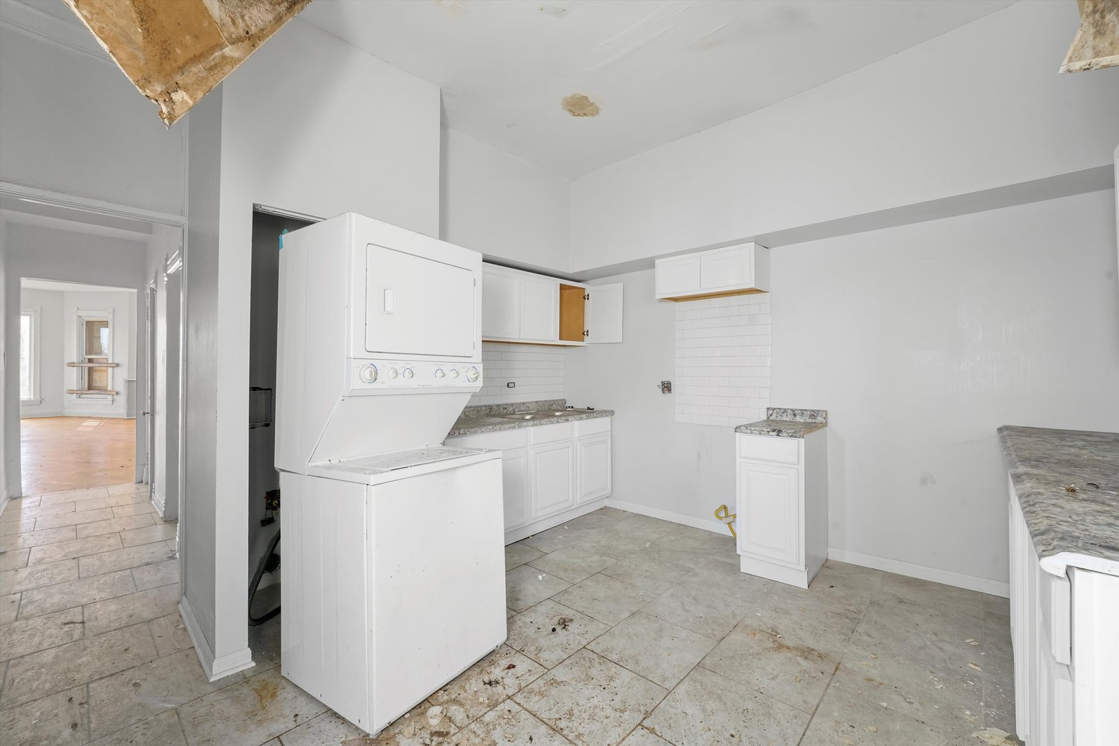 58 West 72nd Street Chicago, IL 60621 - Photo 17 of 28 a utility room with cabinets washer and dryer