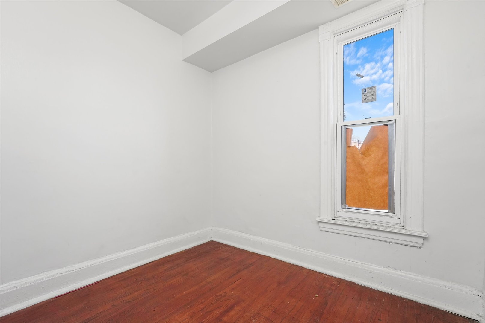 58 West 72nd Street Chicago, IL 60621 - Photo 19 of 28 an empty room with a window