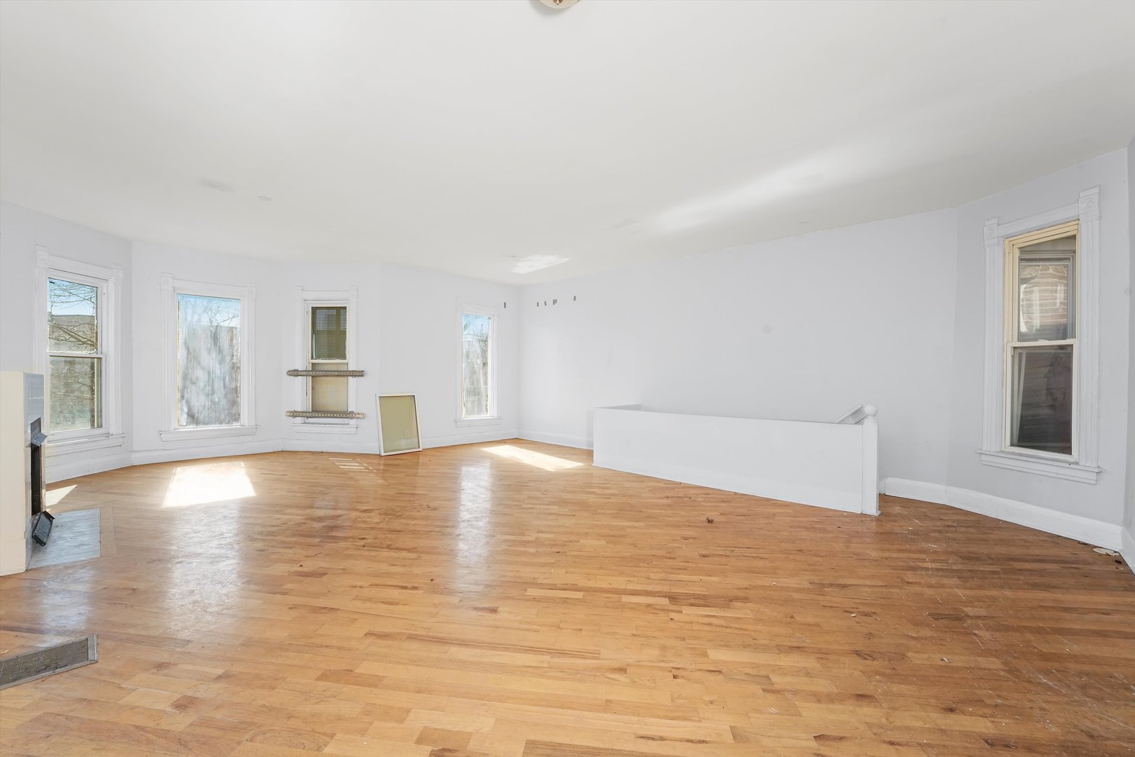 58 West 72nd Street Chicago, IL 60621 - Photo 24 of 28 a view of empty room with wooden floor and windows