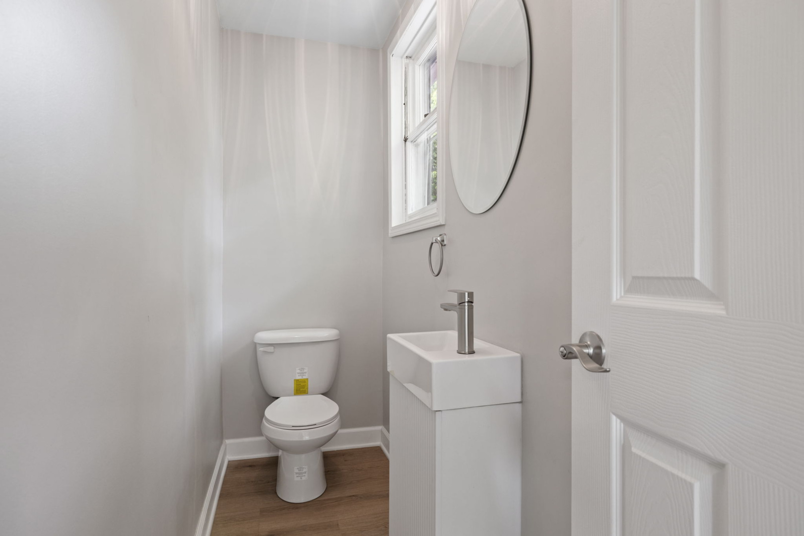 1729 South Hamilton Street Lockport, IL 60441 - Photo 12 of 18 a bathroom with a toilet a sink and a mirror