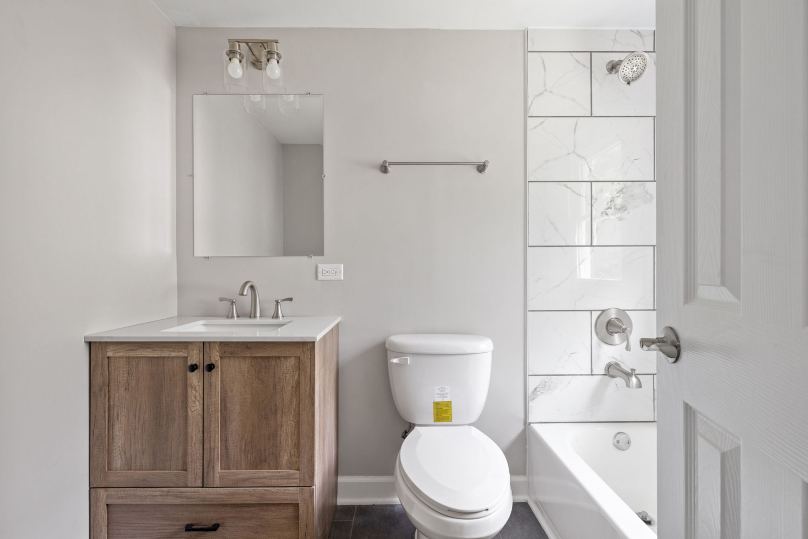1729 South Hamilton Street Lockport, IL 60441 - Photo 14 of 18 a bathroom with a toilet a sink and mirror