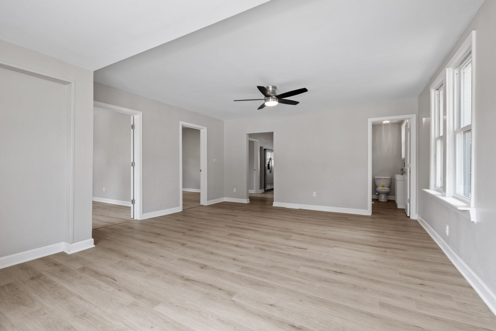 1729 South Hamilton Street Lockport, IL 60441 - Photo 3 of 18 a view of empty room with wooden floor and fan