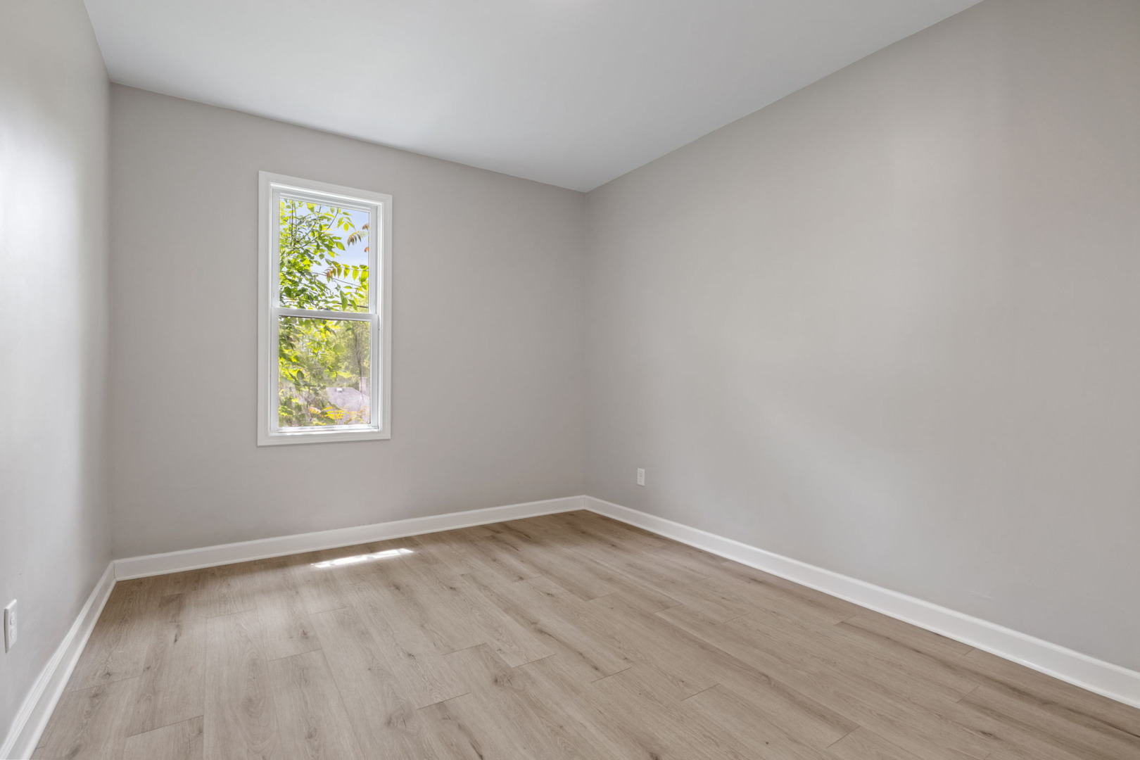 1729 South Hamilton Street Lockport, IL 60441 - Photo 6 of 18 wooden floor in an empty room with a window