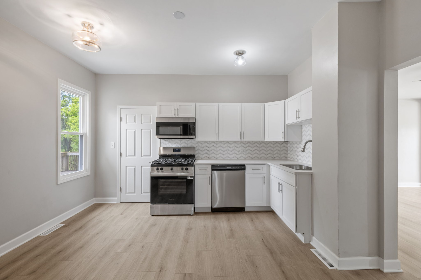 1729 South Hamilton Street Lockport, IL 60441 - Photo 10 of 18 a kitchen with stainless steel appliances granite countertop a stove a sink and a refrigerator
