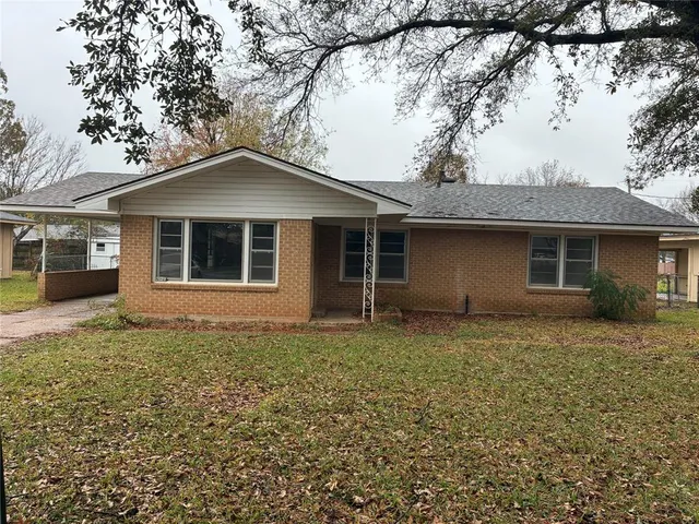 a house with trees in the background