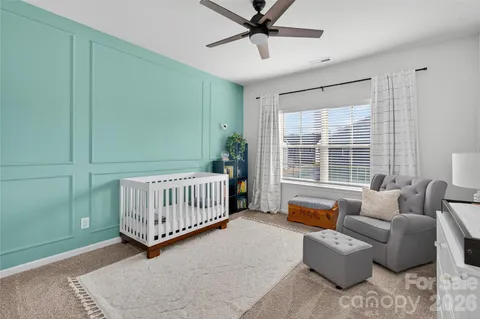 a bedroom with furniture and windows