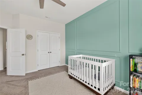 a view of a room with gym equipment and a window