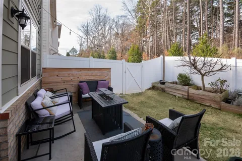 a view of a patio with couple of chairs