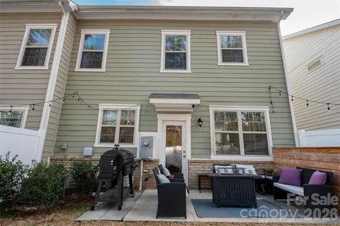 a front view of a house with outdoor seating