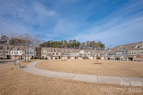 aerial view of a house with a yard