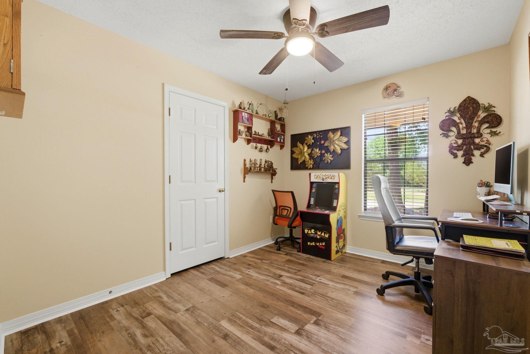 5121 Keyser Mill Road Baker, FL 32531 - Photo 26 of 52 a view of a livingroom with workspace and a window