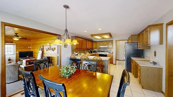 a kitchen with stainless steel appliances granite countertop a refrigerator stove and sink