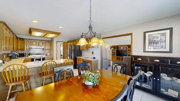 a kitchen that has a sink and a refrigerator