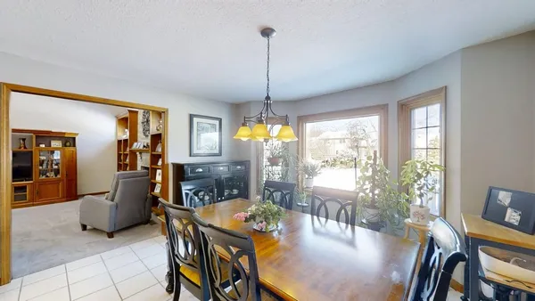 a kitchen with stainless steel appliances granite countertop a refrigerator stove and sink