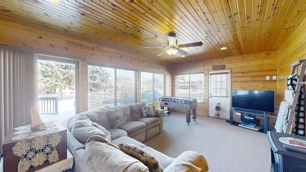 a bed room with a bed and a television