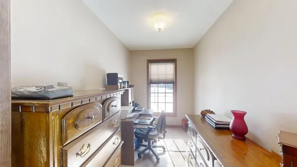 a bed room with a bed and a chandelier