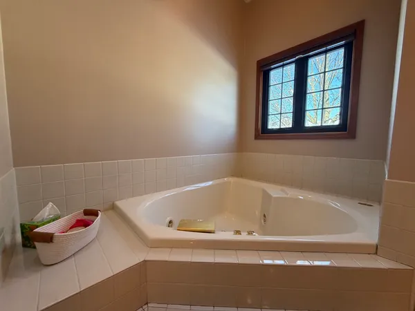 a view of a room with furniture and wooden floor