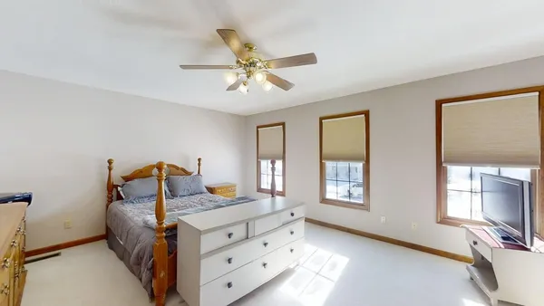 a view of a room with furniture and wooden floor