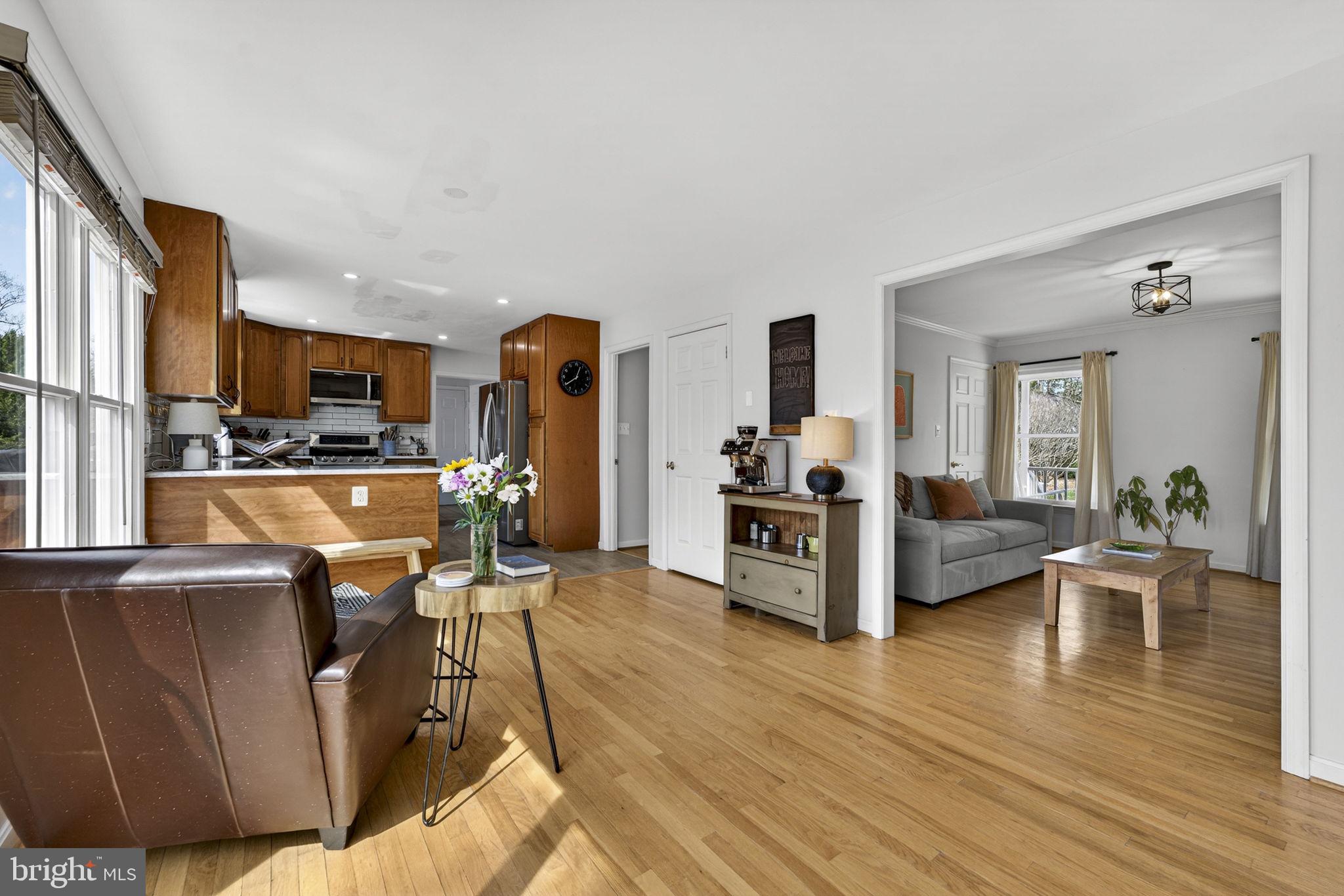 10507 Cliff Mills Road Marshall, VA 20115 - Photo 13 of 56 a living room with furniture kitchen view and a wooden floor