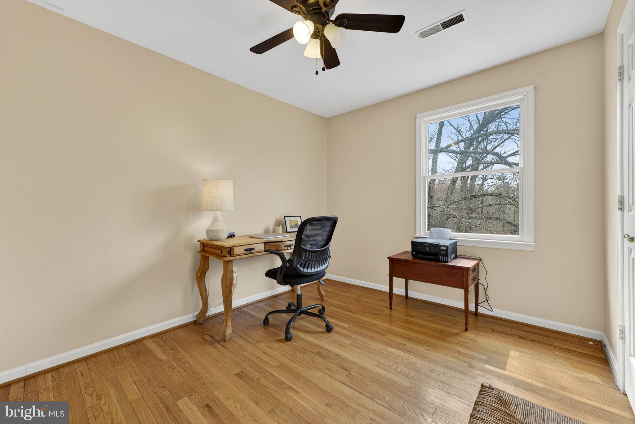 10507 Cliff Mills Road Marshall, VA 20115 - Photo 26 of 56 a view of a workspace with furniture and a window