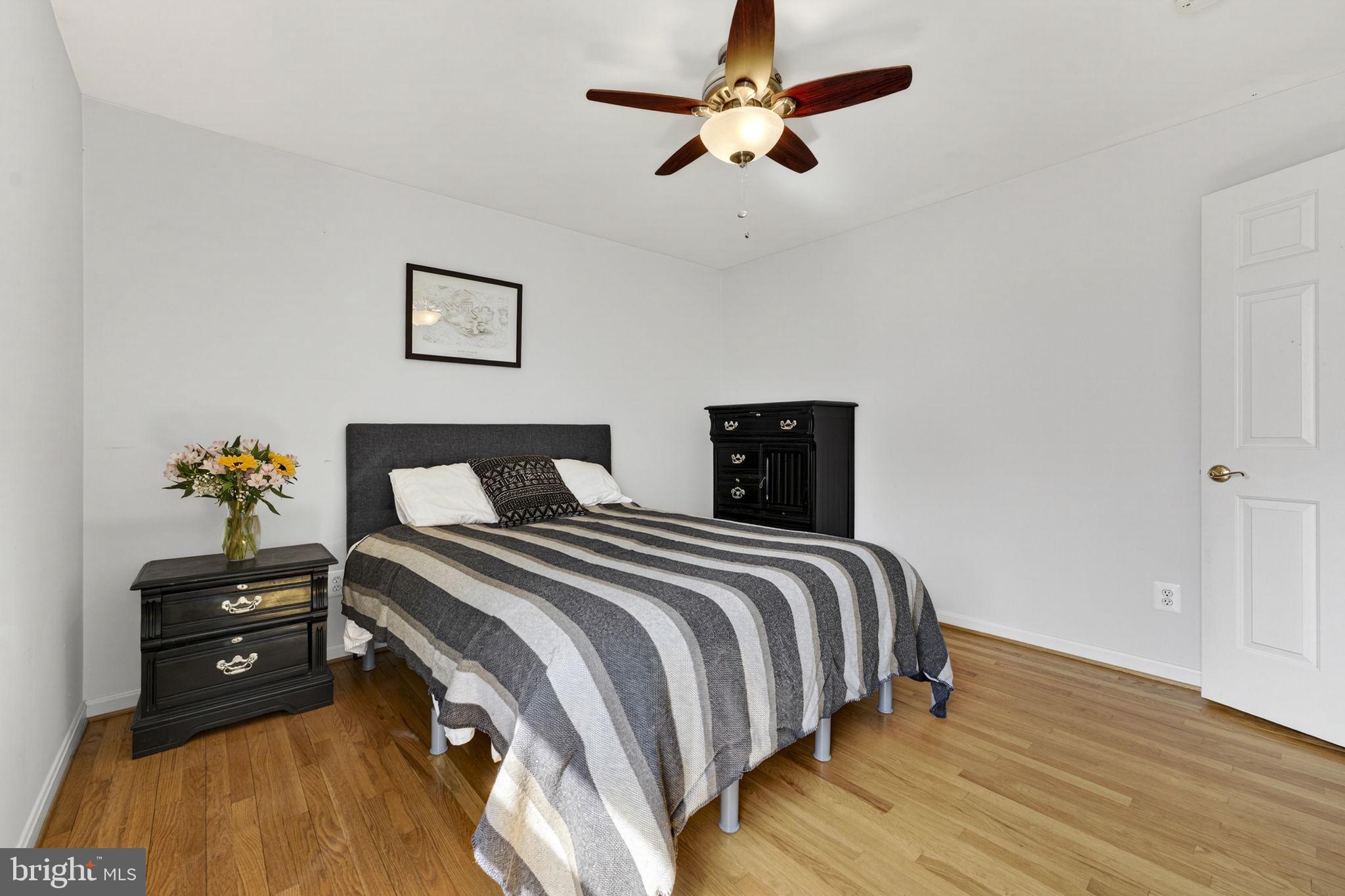 10507 Cliff Mills Road Marshall, VA 20115 - Photo 34 of 56 a bedroom with a bed and wooden floor
