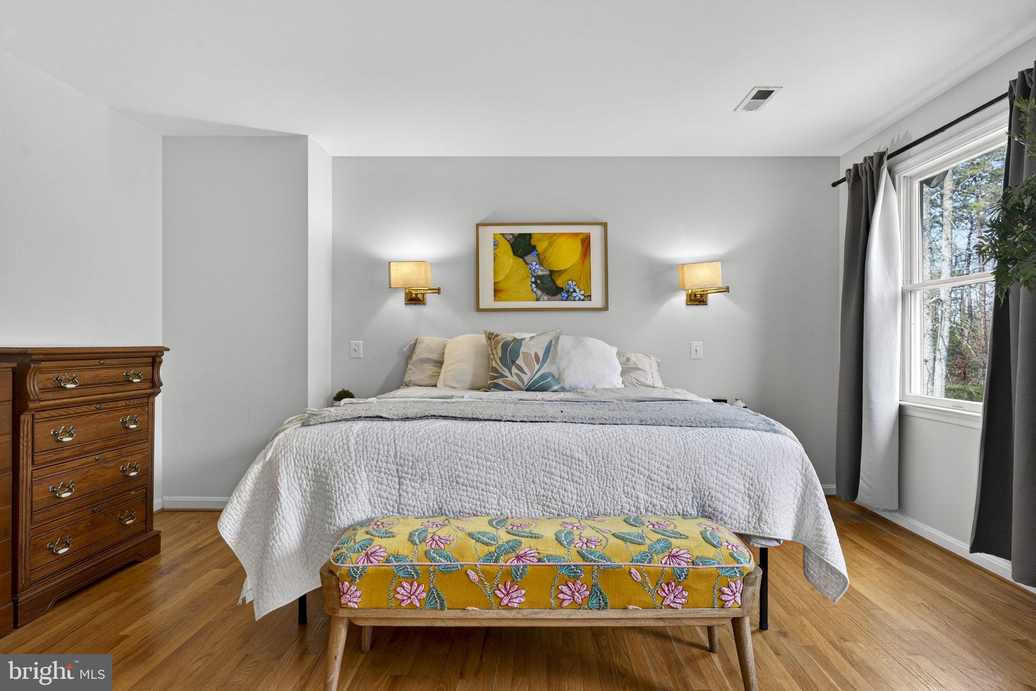 10507 Cliff Mills Road Marshall, VA 20115 - Photo 38 of 56 a bedroom with a bed and wooden floor