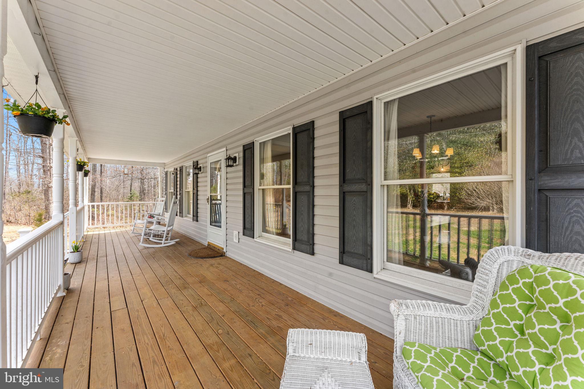 10507 Cliff Mills Road Marshall, VA 20115 - Photo 47 of 56 a view of a balcony with wooden floor