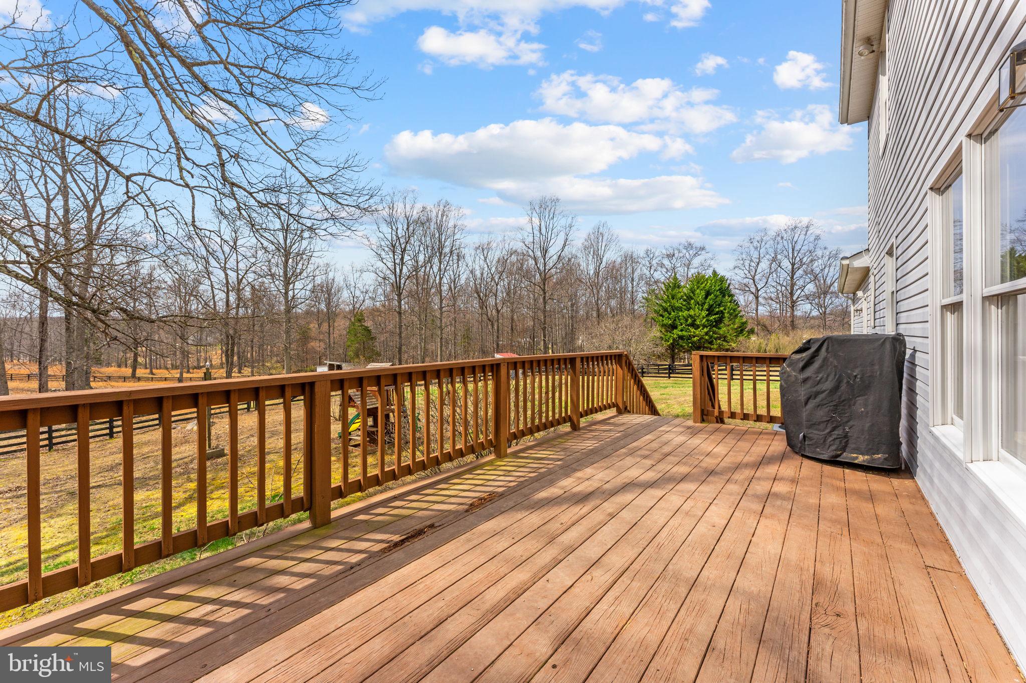 10507 Cliff Mills Road Marshall, VA 20115 - Photo 48 of 56 a view of balcony with wooden floor and fence