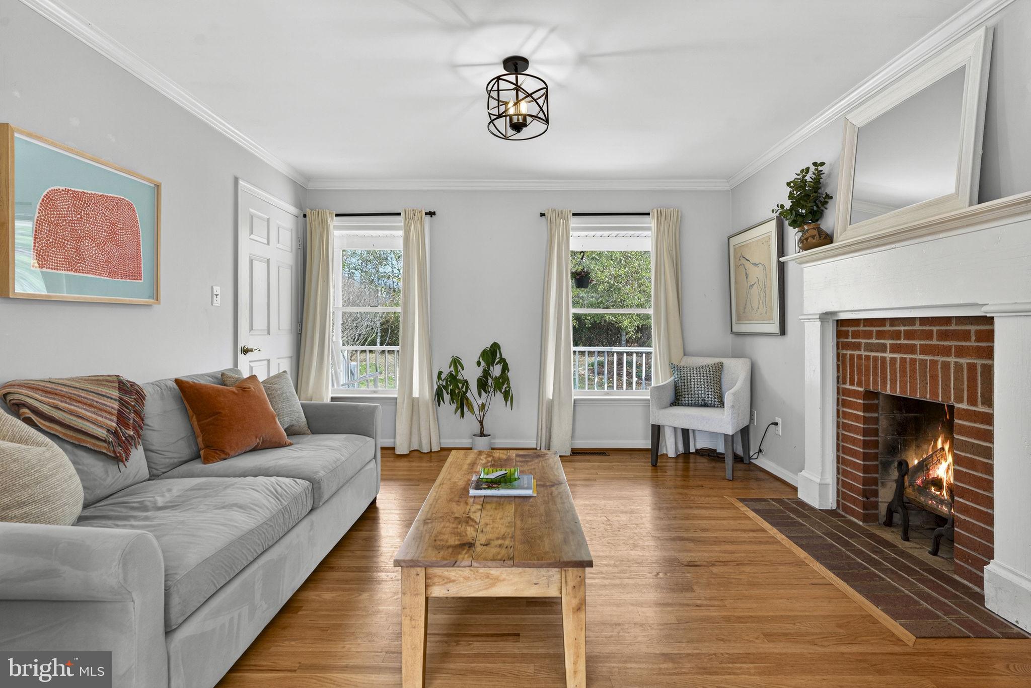 10507 Cliff Mills Road Marshall, VA 20115 - Photo 8 of 56 a living room with furniture and a fireplace