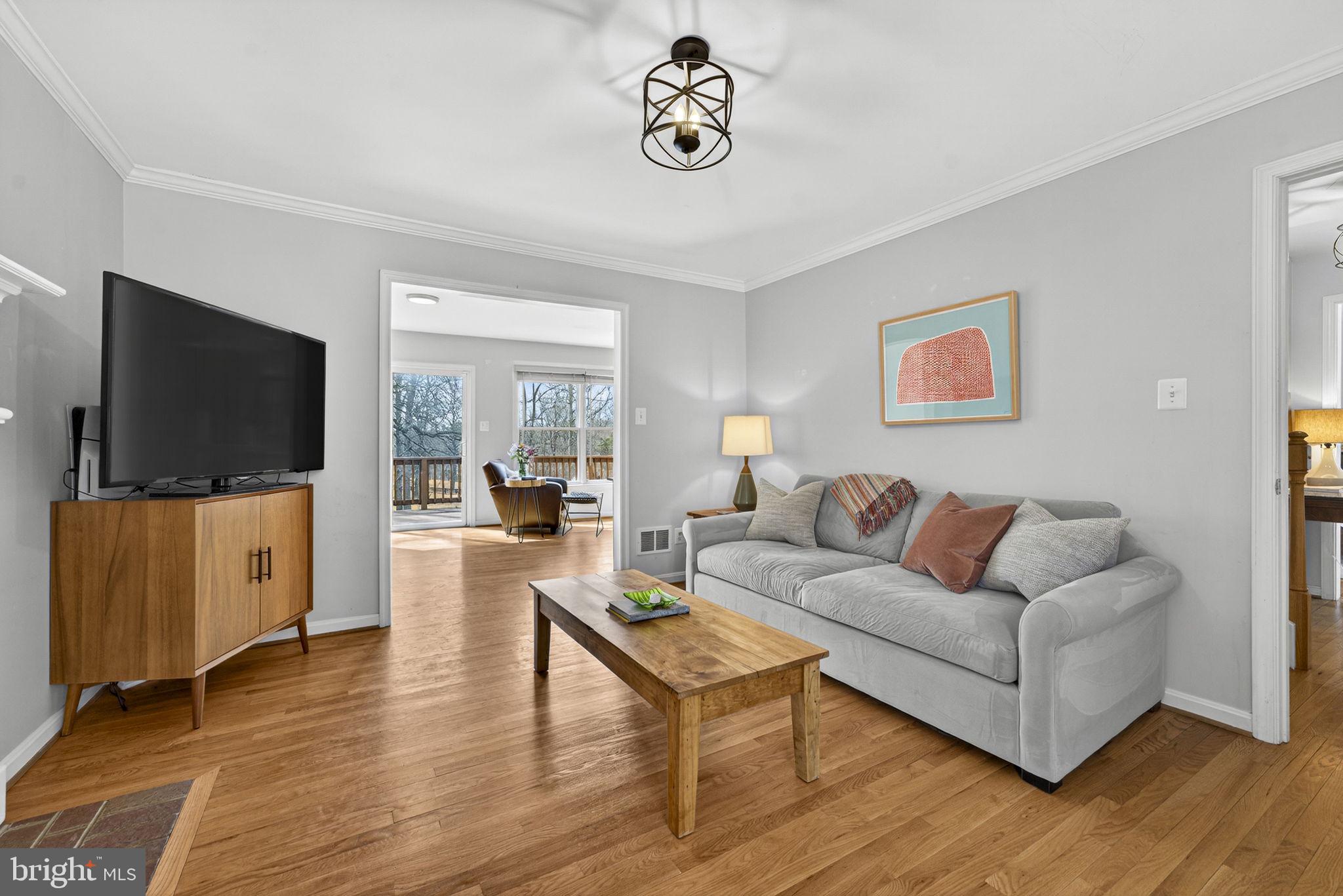 10507 Cliff Mills Road Marshall, VA 20115 - Photo 10 of 56 a living room with furniture and a flat screen tv