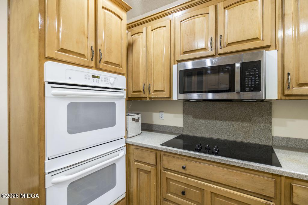 80 Mallard Pointe Kathleen, GA 31047 - Photo 15 of 34 a kitchen with granite countertop cabinets stainless steel appliances and a counter space