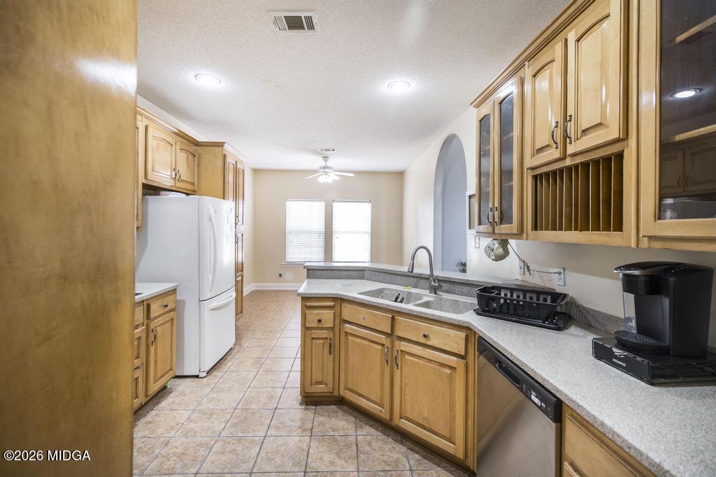 80 Mallard Pointe Kathleen, GA 31047 - Photo 16 of 34 a kitchen with a sink stove and cabinets