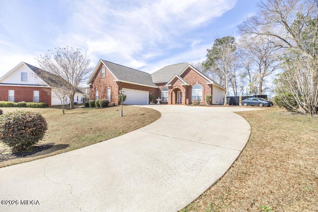 80 Mallard Pointe Kathleen, GA 31047 - Photo 2 of 34 front view of a house with a yard